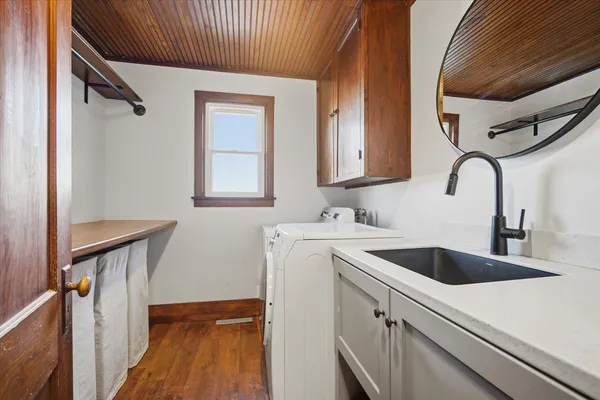 a view of a sink and a microwave
