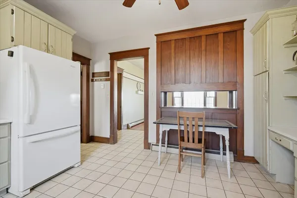 a kitchen with stainless steel appliances a refrigerator and a stove top oven