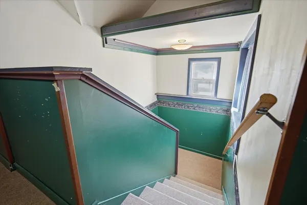 a view of a stairs and an entryway