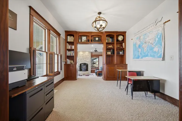 a living room with furniture stove and a window