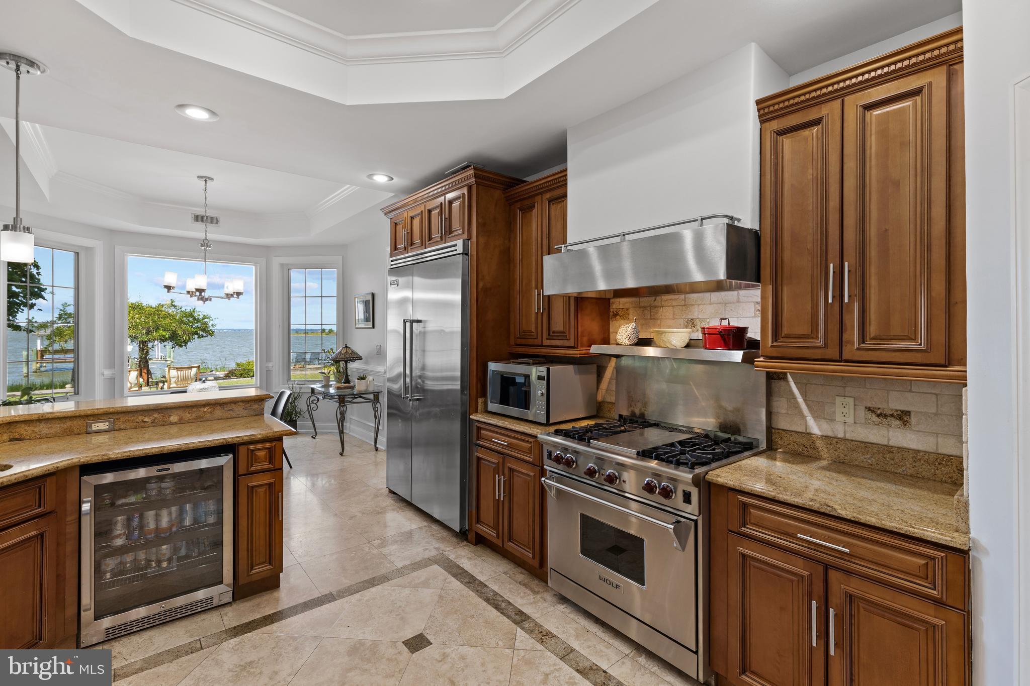 4819 Avery Road Shady Side, MD 20764 - Photo 17 of 44 a kitchen with stainless steel appliances granite countertop a stove a sink and a microwave