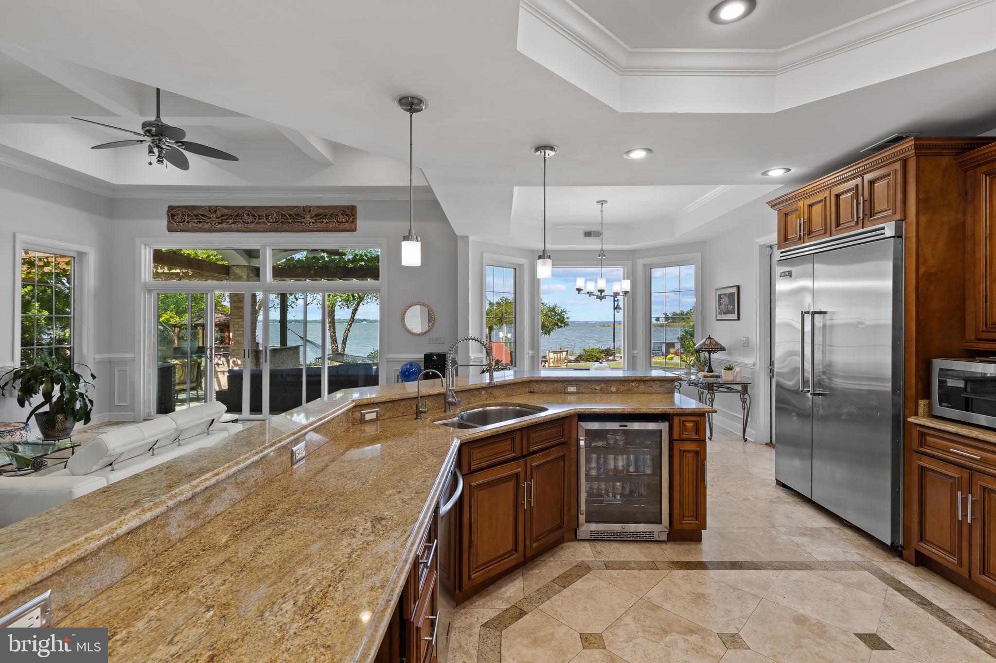 4819 Avery Road Shady Side, MD 20764 - Photo 18 of 44 a large kitchen with stainless steel appliances granite countertop a sink and cabinets