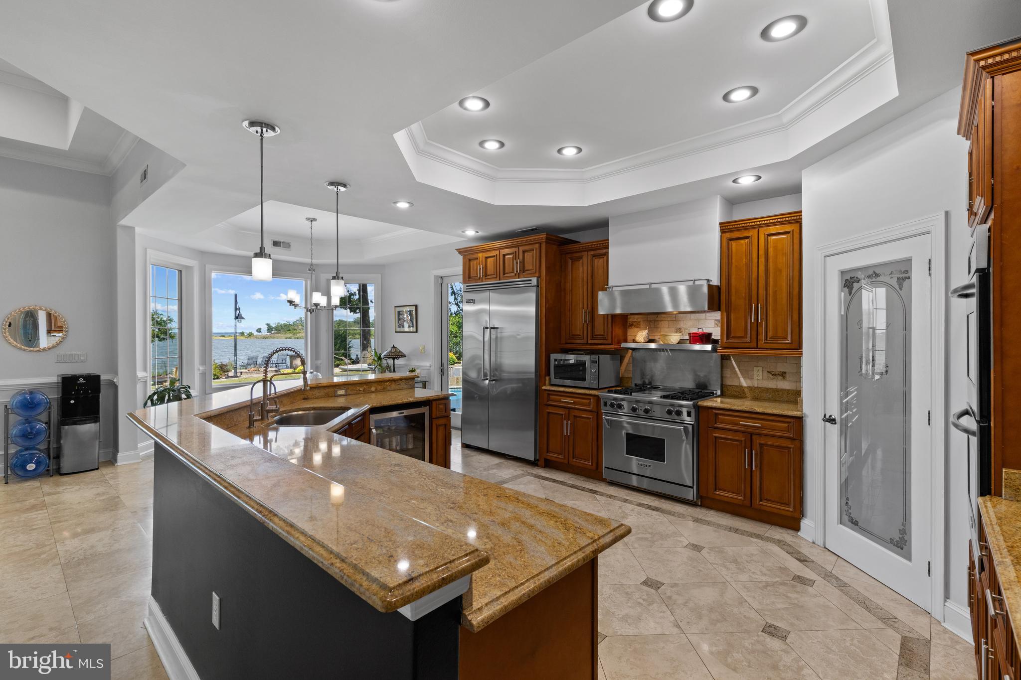4819 Avery Road Shady Side, MD 20764 - Photo 19 of 44 a kitchen with stainless steel appliances granite countertop a sink and a refrigerator