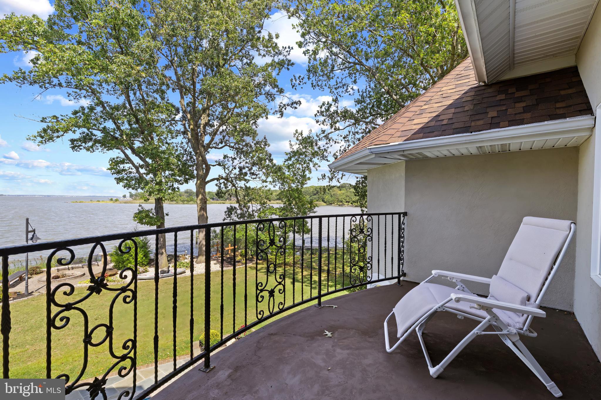 4819 Avery Road Shady Side, MD 20764 - Photo 27 of 44 a balcony with table and chairs