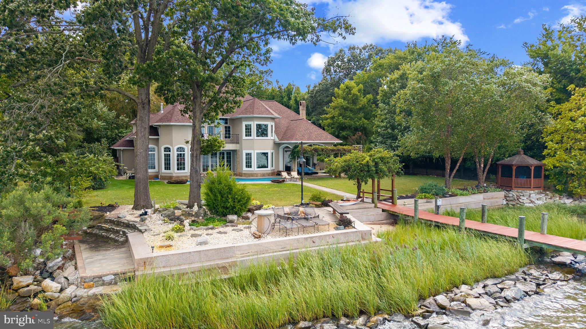 4819 Avery Road Shady Side, MD 20764 - Photo 3 of 44 a view of a house with swimming pool and sitting area
