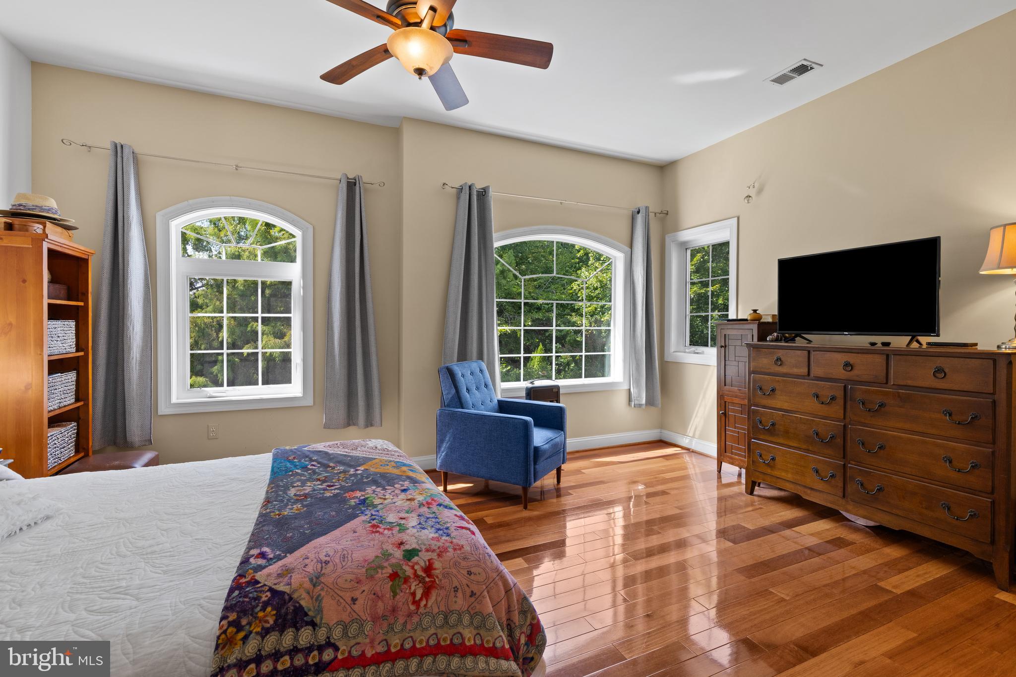 4819 Avery Road Shady Side, MD 20764 - Photo 32 of 44 a bedroom with a bed and wooden floor