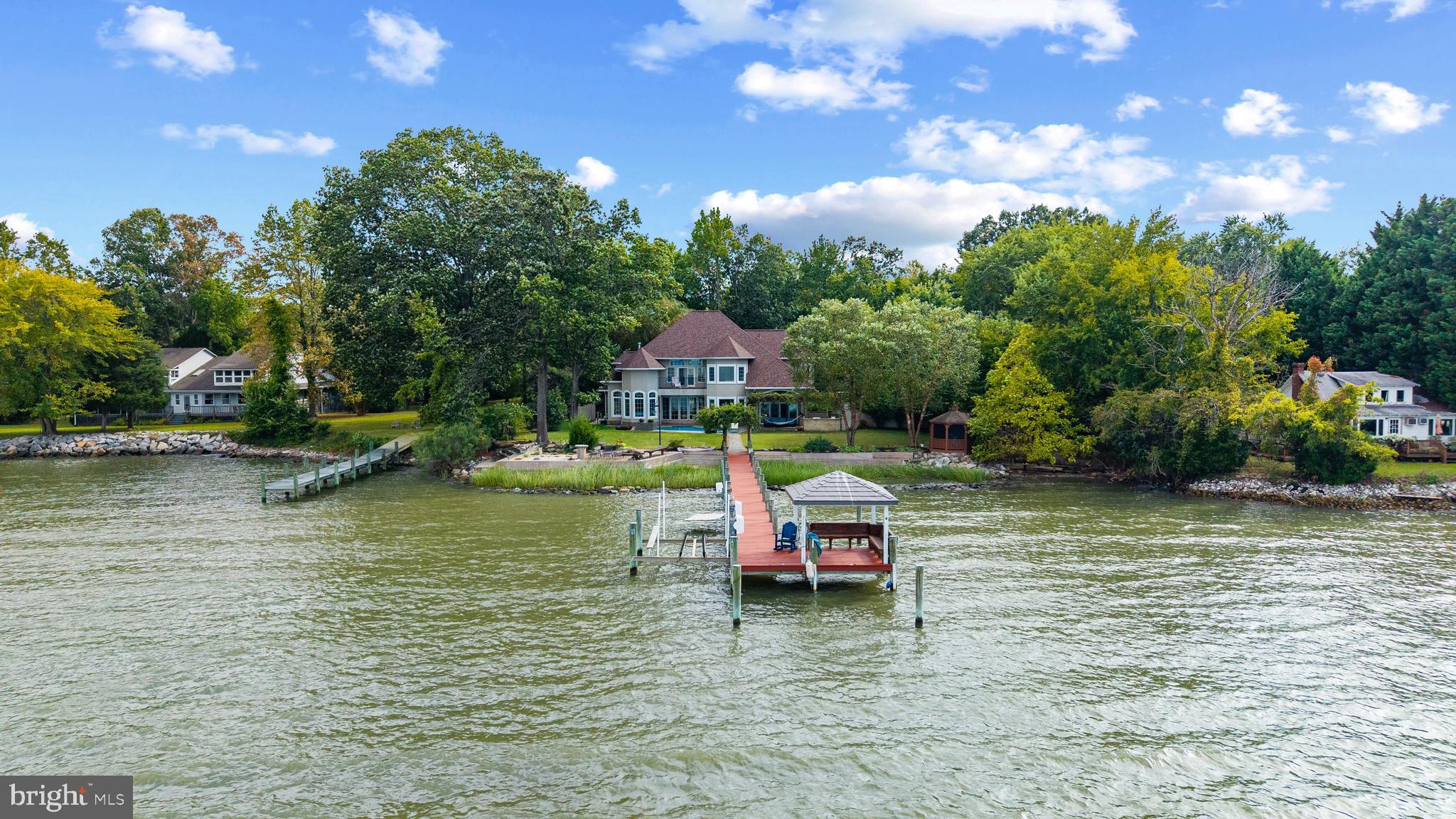 4819 Avery Road Shady Side, MD 20764 - Photo 41 of 44 a swimming pool with trees in the background