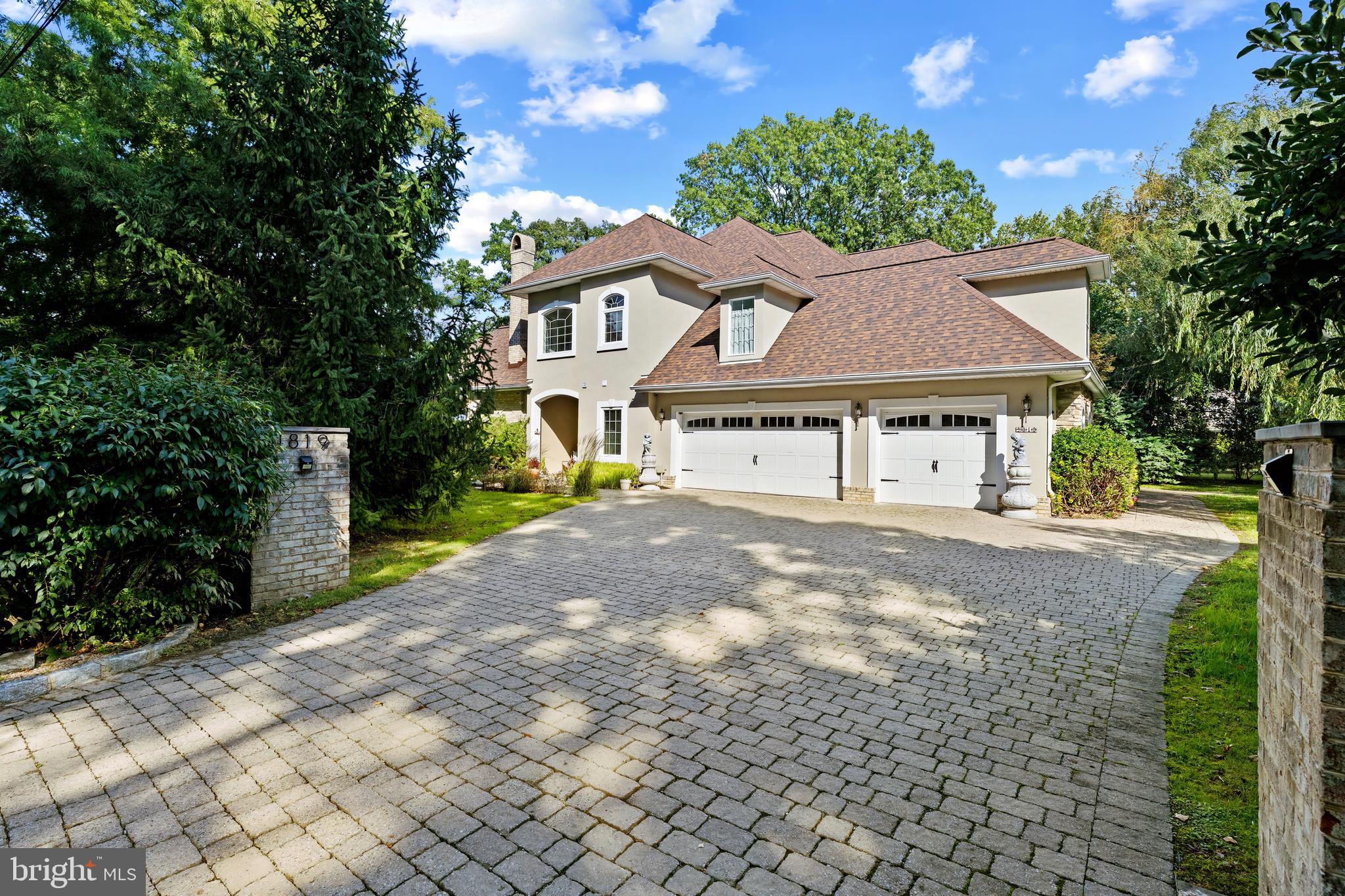 4819 Avery Road Shady Side, MD 20764 - Photo 43 of 44 a front view of a house with a yard and garage