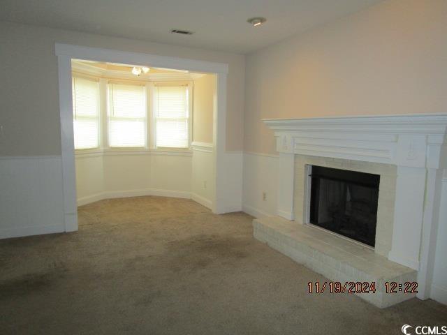 321 Heritage Road Conway, SC 29527 - Photo 5 of 15 Unfurnished living room with light colored carpet