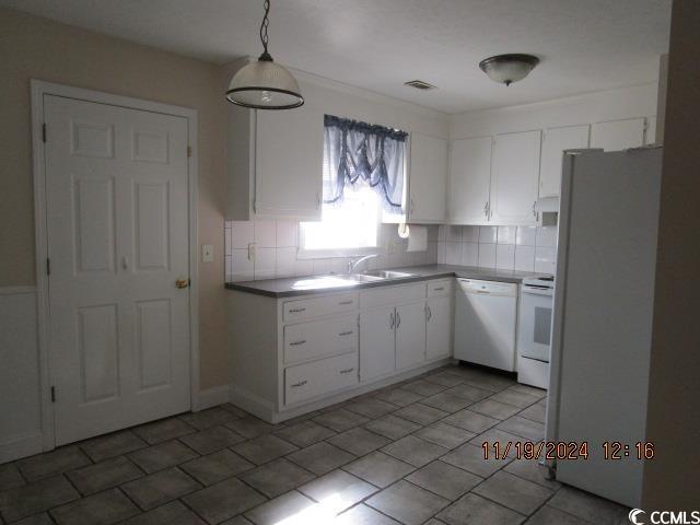 321 Heritage Road Conway, SC 29527 - Photo 7 of 15 Kitchen featuring white cabinets, pendant lighting