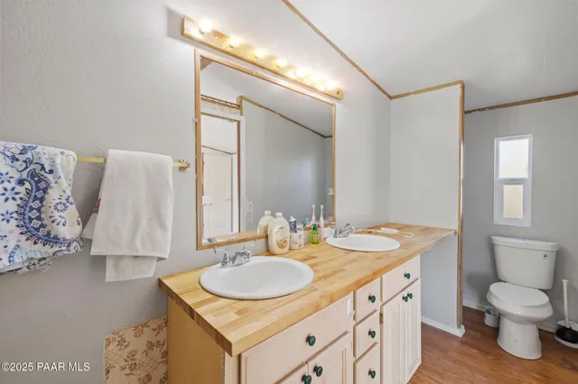 a bathroom with a sink double vanity and a mirror