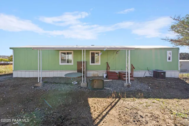a view of a backyard with furniture