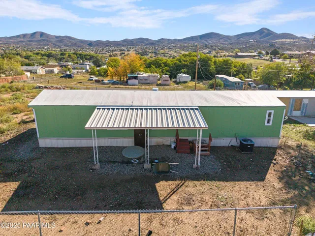aerial view of a house with a lake view