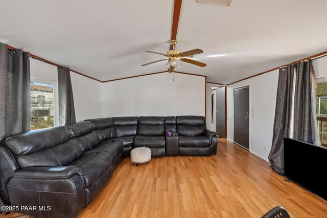 a living room with furniture and a rug