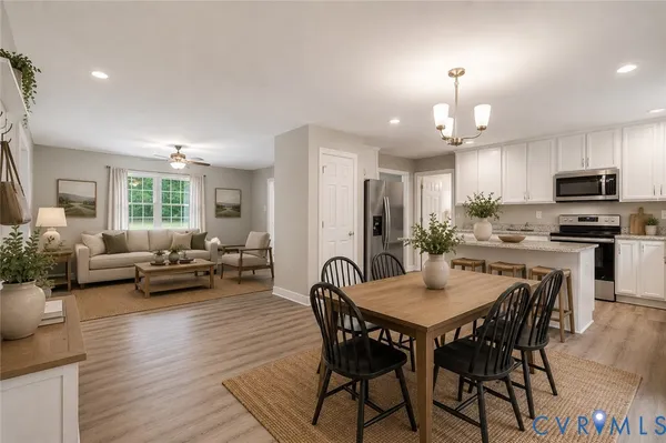a view of a dining room with furniture and wooden floor