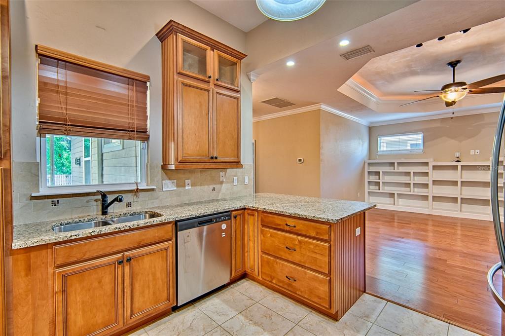 7546 Southwest 90th Drive Gainesville, FL 32608 - Photo 13 of 46 a kitchen with stainless steel appliances granite countertop a sink and cabinets