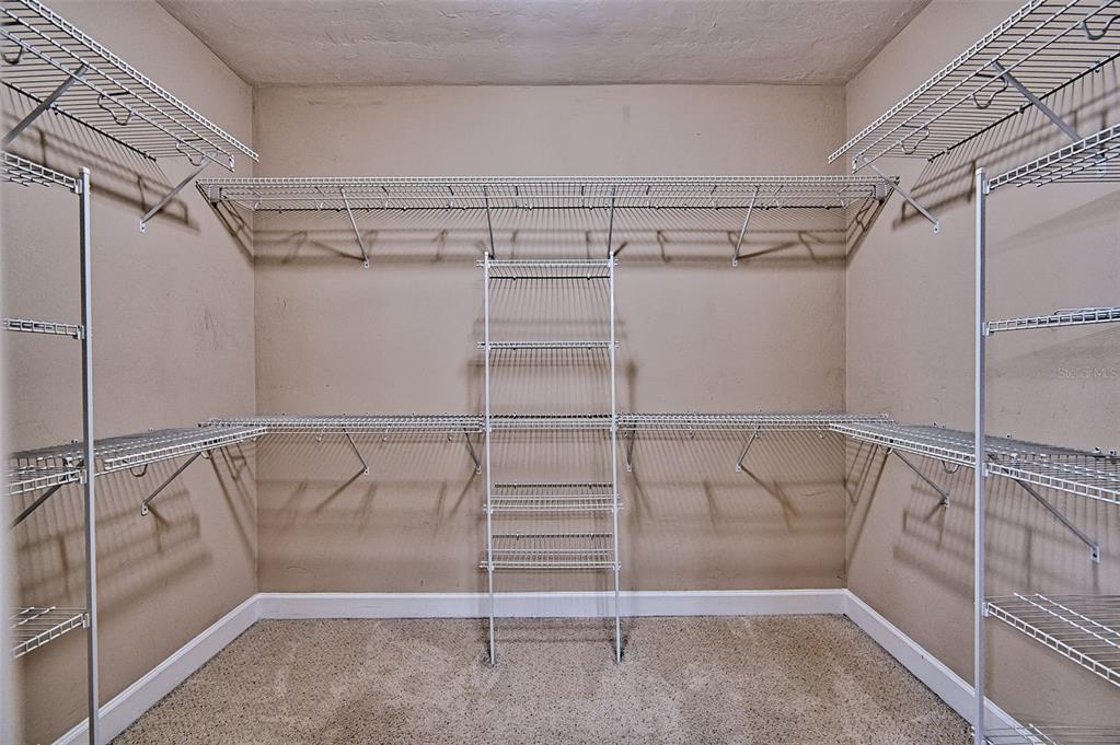 7546 Southwest 90th Drive Gainesville, FL 32608 - Photo 20 of 46 a view of a room with racks on the wall