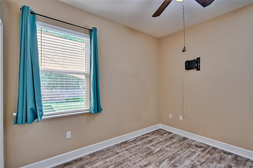 7546 Southwest 90th Drive Gainesville, FL 32608 - Photo 21 of 46 a view of a room that has a window in it