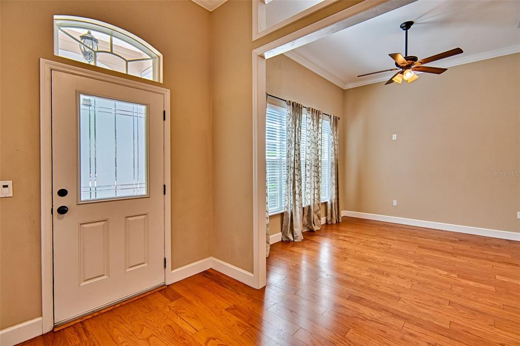 7546 Southwest 90th Drive Gainesville, FL 32608 - Photo 3 of 46 wooden floor in an empty room with a window