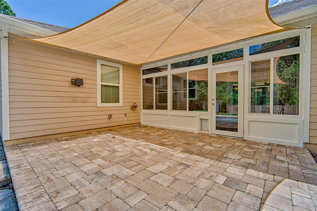 7546 Southwest 90th Drive Gainesville, FL 32608 - Photo 32 of 46 a view of a porch with a bench