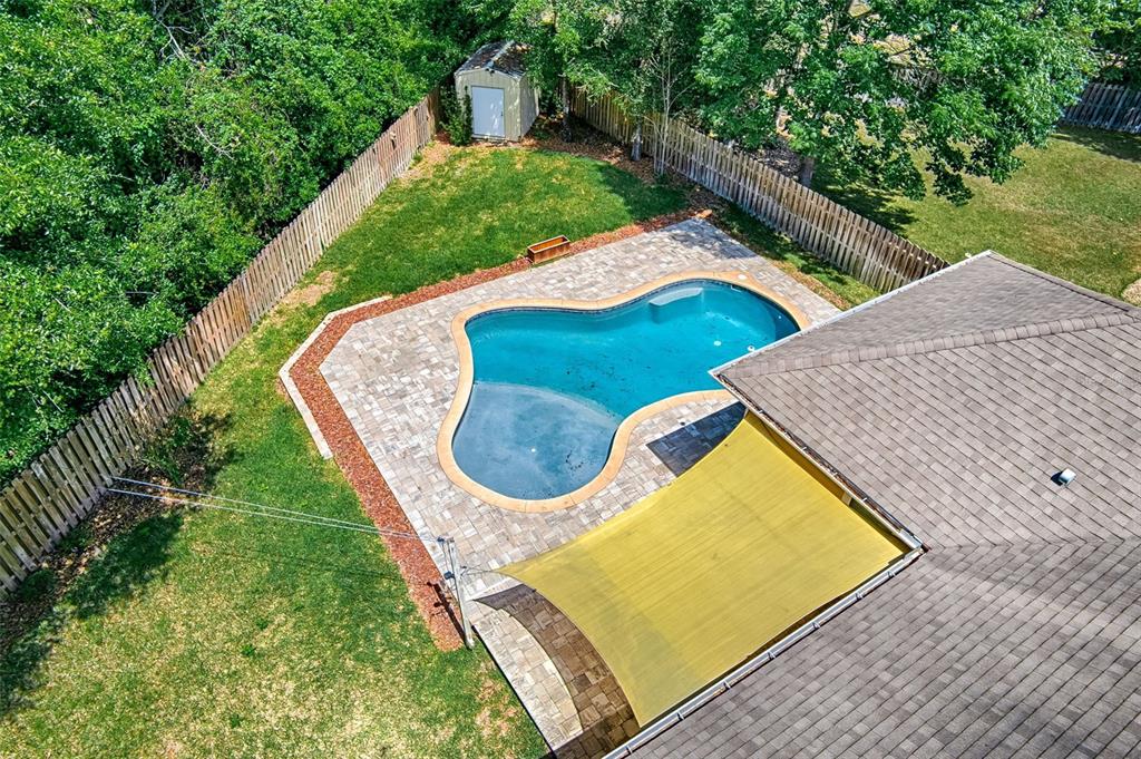 7546 Southwest 90th Drive Gainesville, FL 32608 - Photo 33 of 46 a view of a swimming pool with a patio
