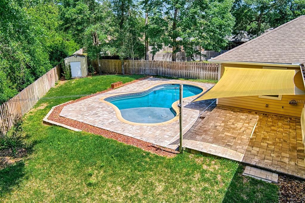 7546 Southwest 90th Drive Gainesville, FL 32608 - Photo 35 of 46 a view of a backyard with swimming pool