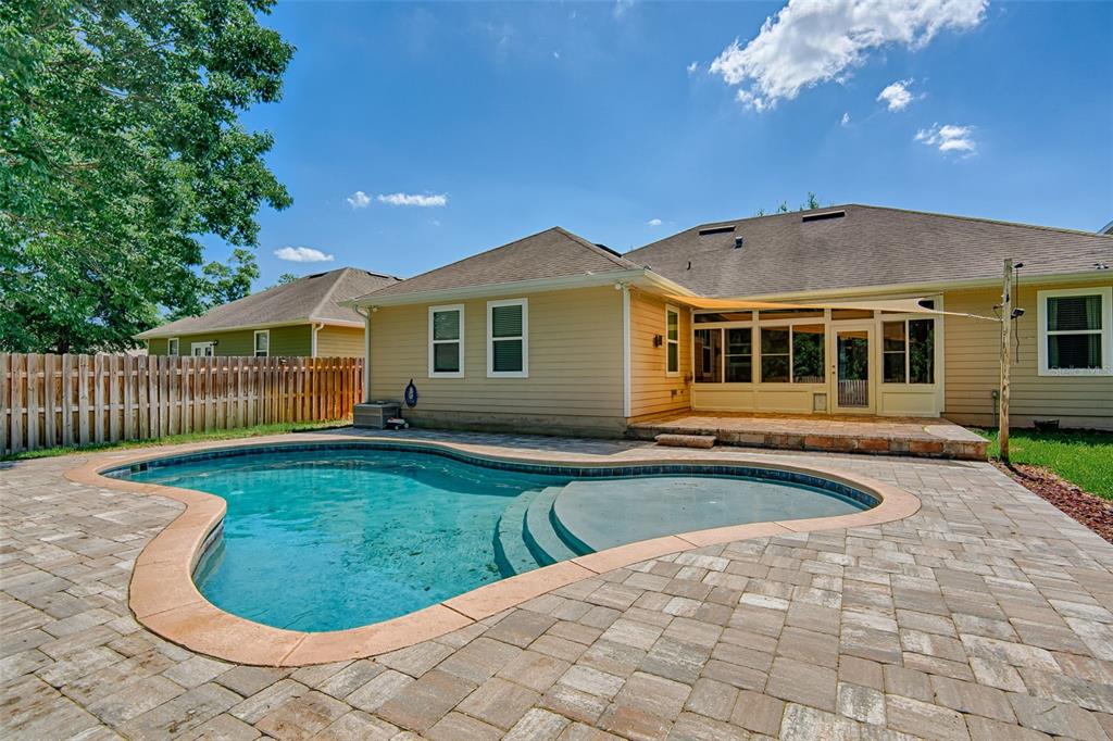 7546 Southwest 90th Drive Gainesville, FL 32608 - Photo 36 of 46 a view of a house with a swimming pool