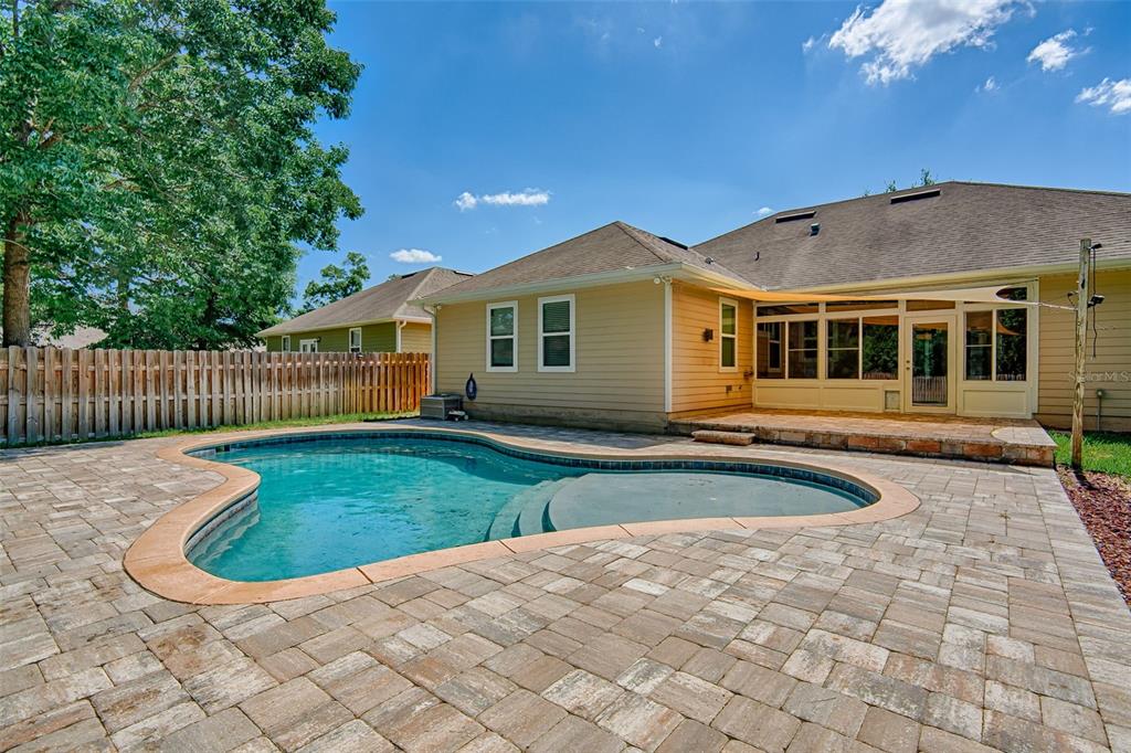 7546 Southwest 90th Drive Gainesville, FL 32608 - Photo 38 of 46 a view of a house with backyard and tree