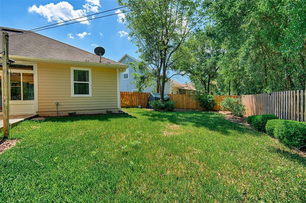 7546 Southwest 90th Drive Gainesville, FL 32608 - Photo 39 of 46 a view of a house with a backyard