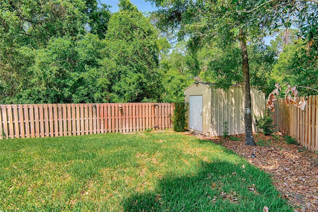 7546 Southwest 90th Drive Gainesville, FL 32608 - Photo 41 of 46 a view of a deck with a small yard
