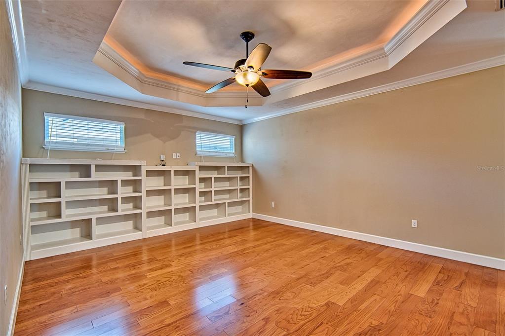 7546 Southwest 90th Drive Gainesville, FL 32608 - Photo 6 of 46 a view of an empty room with a window and wooden floor