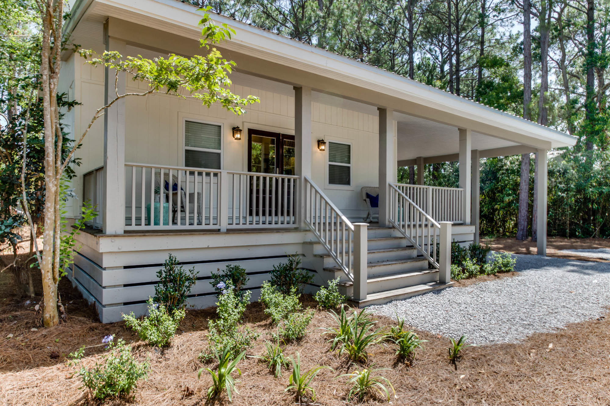 46 Cypress Pond Road Santa Rosa Beach, FL 32459 - Photo 2 of 36 a view of a deck with a table and chairs