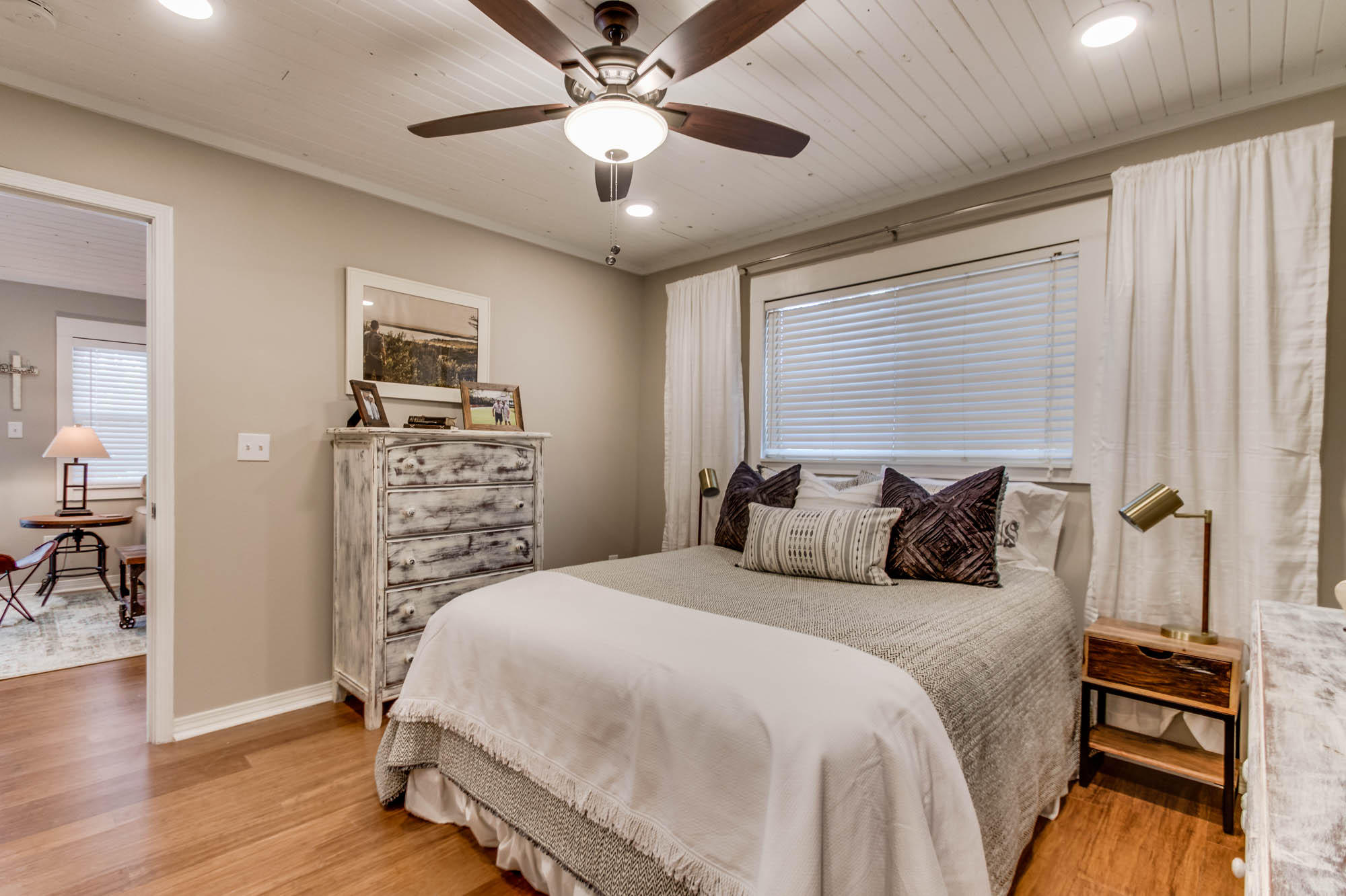 46 Cypress Pond Road Santa Rosa Beach, FL 32459 - Photo 20 of 36 a bedroom with a bed and a chandelier