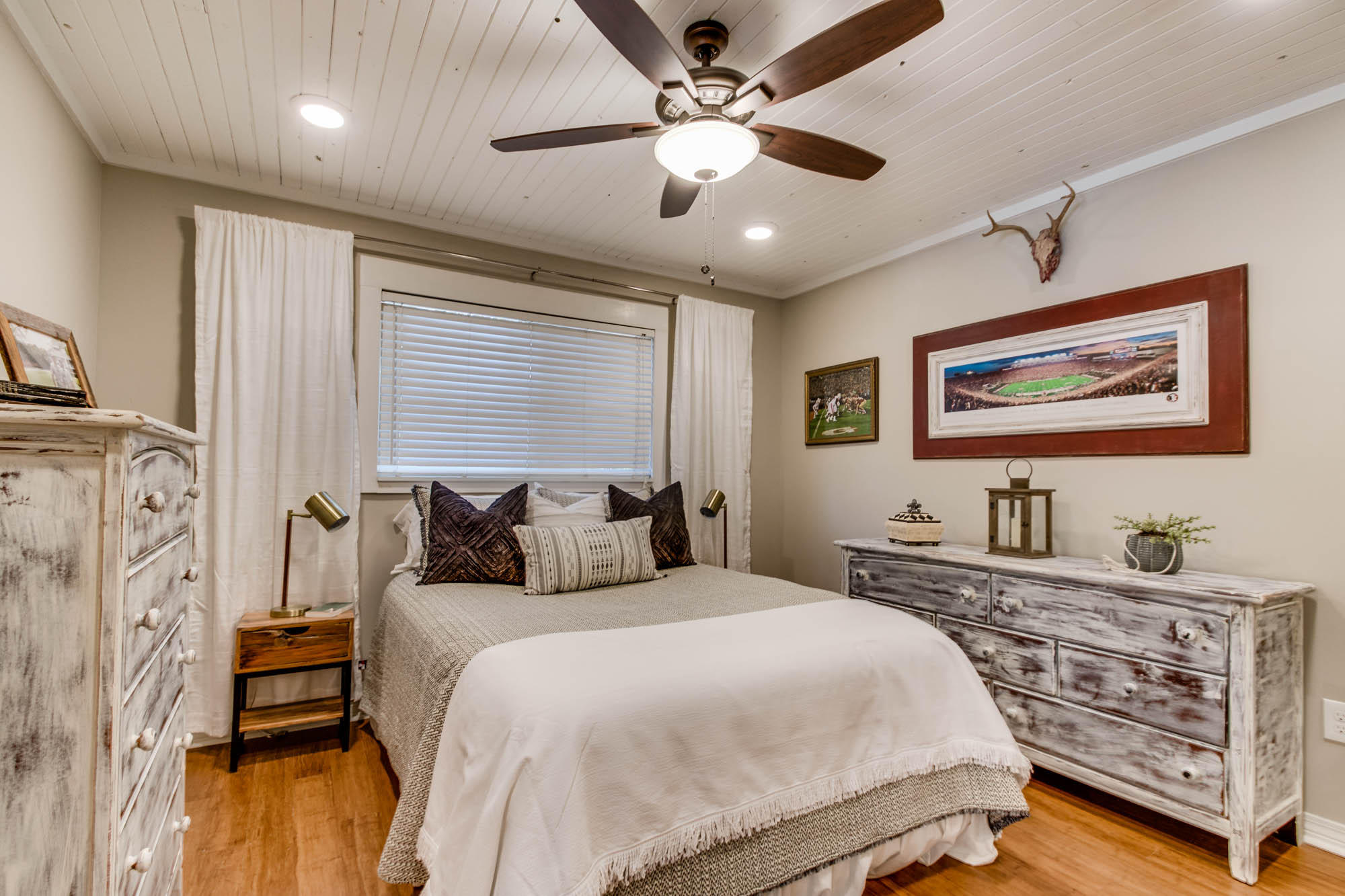 46 Cypress Pond Road Santa Rosa Beach, FL 32459 - Photo 21 of 36 a bedroom with a bed and a chandelier