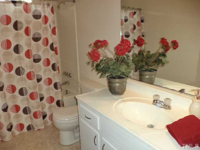 1106 Aversboro Road Garner, NC 27529 - Photo 8 of 12 Full bathroom has newvinyl floors and fresh paint