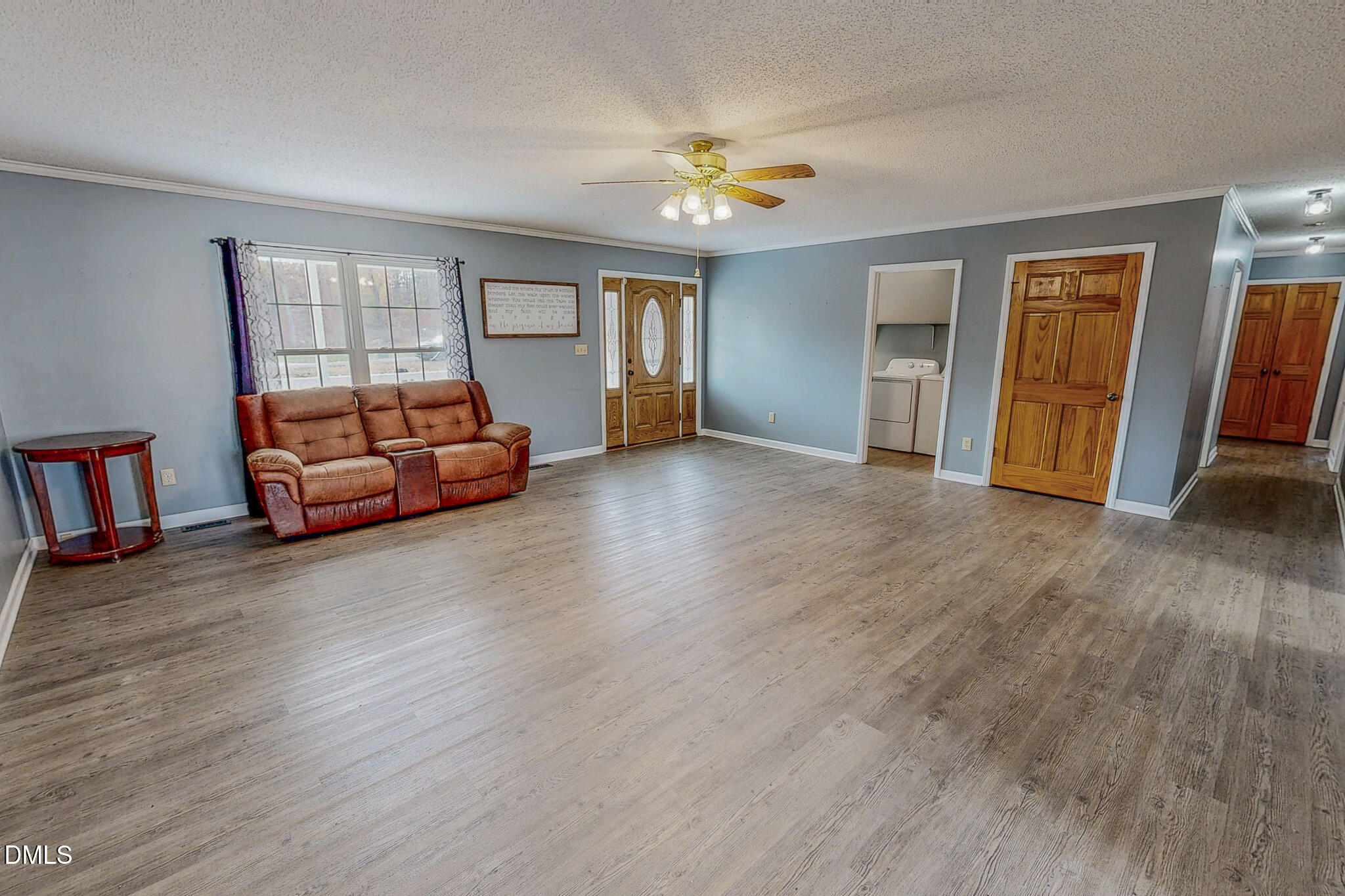 111 Fox Crossing Drive Roxboro, NC 27574 - Photo 6 of 25 a view of livingroom with hardwood floor and ceiling fan