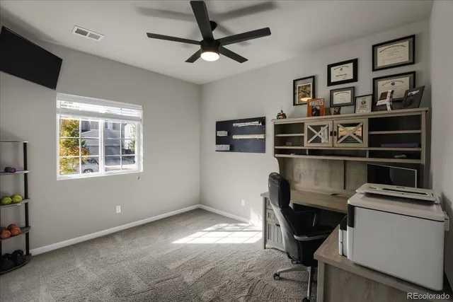 a view of a workspace with furniture