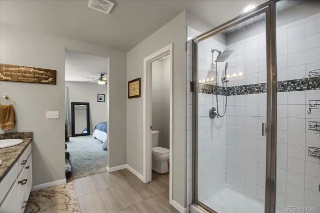 a en suite bathroom with double vanity sinks and a mirror