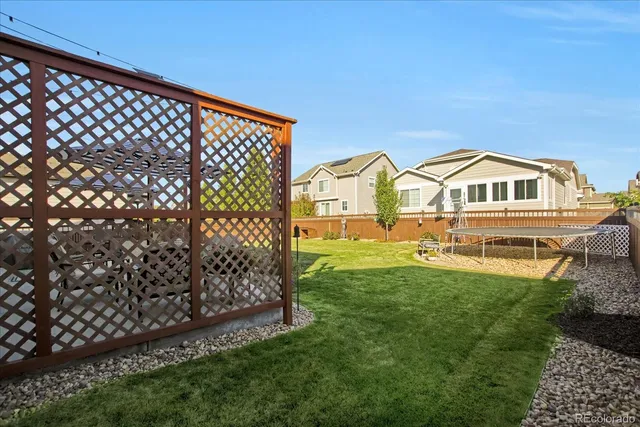a view of a patio with couches table and chairs and potted plants