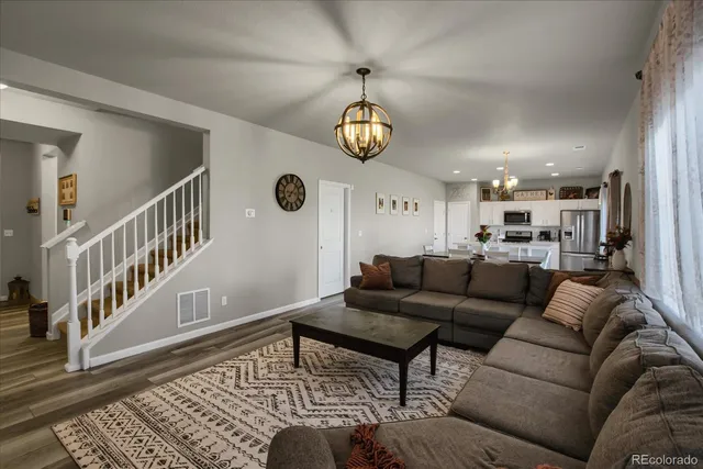 a living room with furniture and a rug