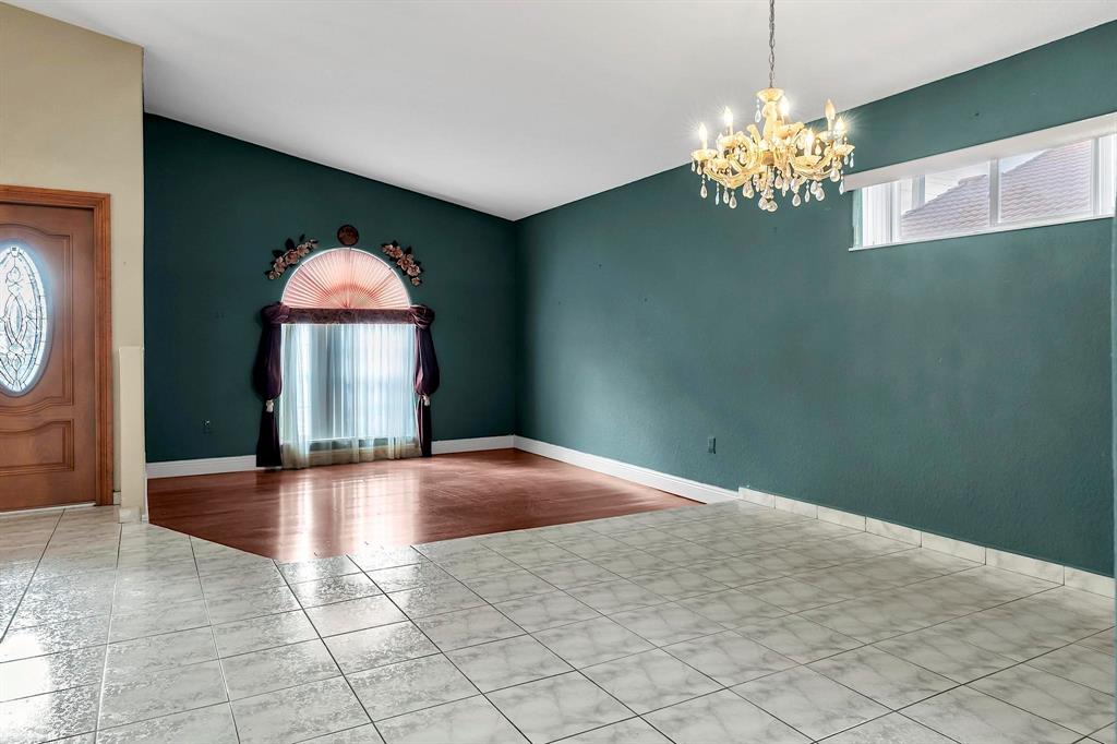 3201 West 76th Street Hialeah, FL 33018 - Photo 12 of 46 a view of a livingroom with a chandelier