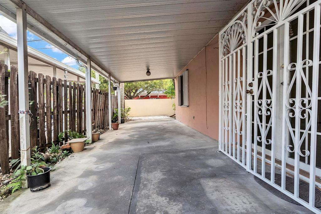 3201 West 76th Street Hialeah, FL 33018 - Photo 37 of 43 a view of entryway with a garden