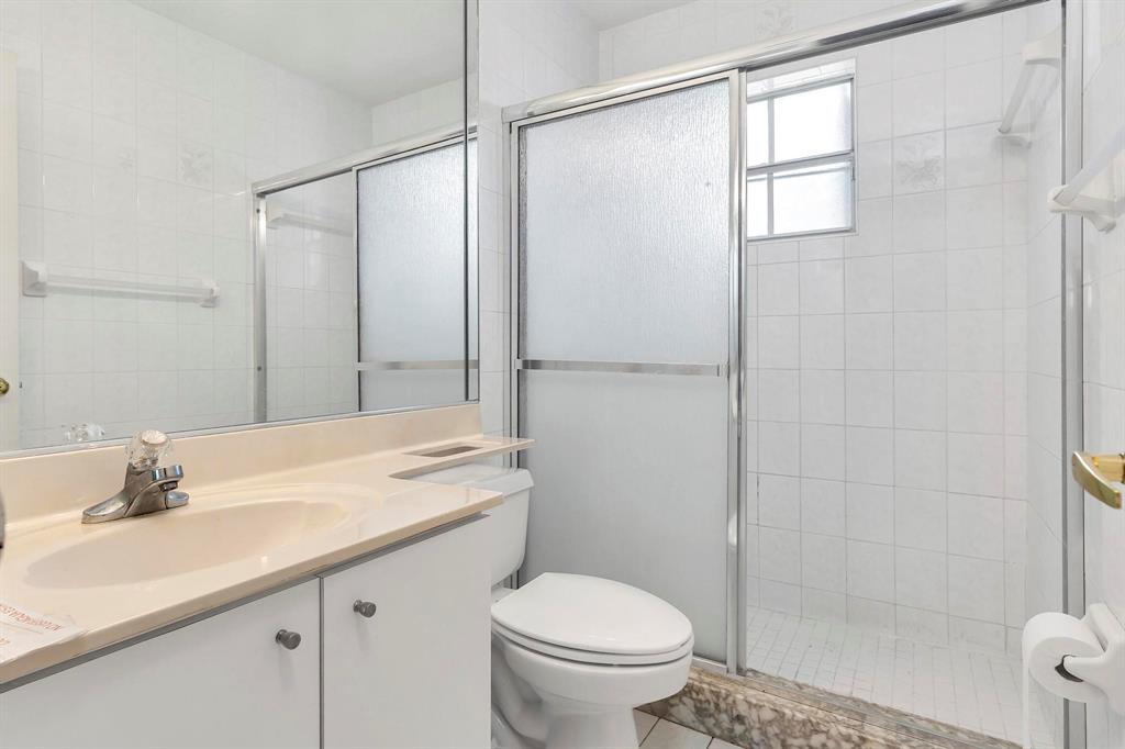 3201 West 76th Street Hialeah, FL 33018 - Photo 40 of 46 a bathroom with a granite countertop sink toilet and shower