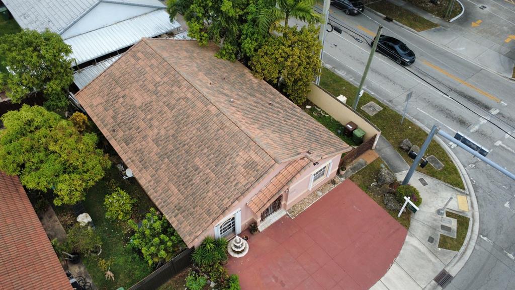 3201 West 76th Street Hialeah, FL 33018 - Photo 5 of 46 an aerial view of a house with a yard and plants