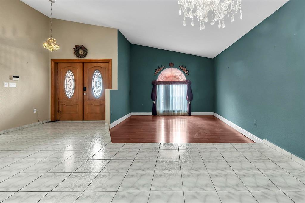 3201 West 76th Street Hialeah, FL 33018 - Photo 9 of 43 a view of a hallway with entryway wooden floor and front door