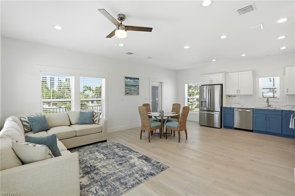 1 Fairview Boulevard Fort Myers Beach, FL 33931 - Photo 6 of 48 Open-concept living space featuring light wood-finish flooring and recessed lighting - Virtually Edited Image