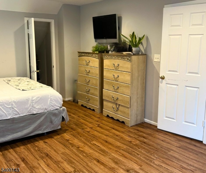 31 Washington Avenue Springfield, NJ 07081 - Photo 12 of 21 a bedroom with a bed and flat screen tv