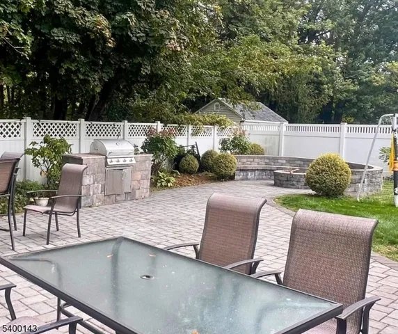 swimming pool view with a seating space