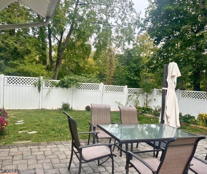31 Washington Avenue Springfield, NJ 07081 - Photo 21 of 21 a view of a chair and table in backyard