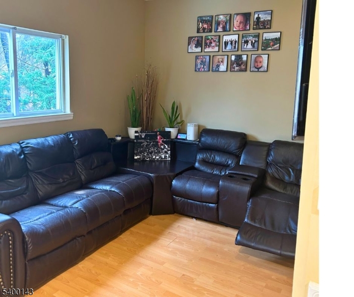 31 Washington Avenue Springfield, NJ 07081 - Photo 7 of 21 a living room with furniture and a window